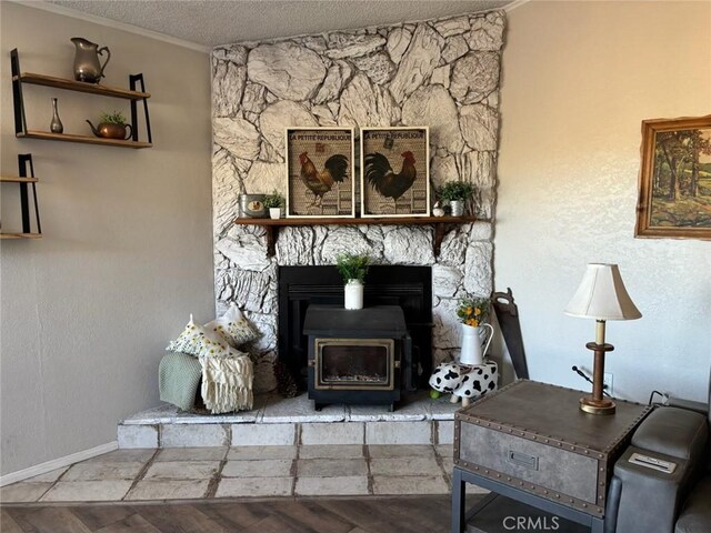 2033 Hollister Rd, Pinon Hills, CA 92372 - living room with ornamental molding, a wood stove, and a textured ceiling