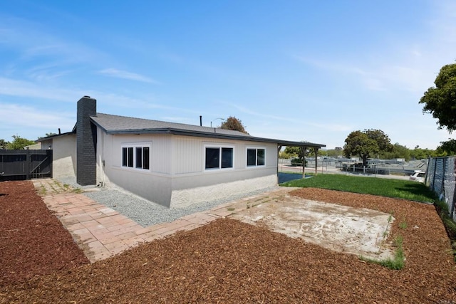 101 Coolwater Dr, San Diego, CA 92114 - rear view of property with a fenced backyard, a chimney, and a patio area