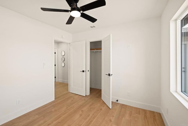 101 Coolwater Dr, San Diego, CA 92114 - unfurnished bedroom with light wood-type flooring, a ceiling fan, and multiple windows
