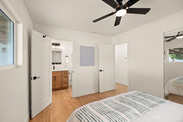 101 Coolwater Dr, San Diego, CA 92114 - bedroom featuring light wood finished floors, connected bathroom, and a ceiling fan