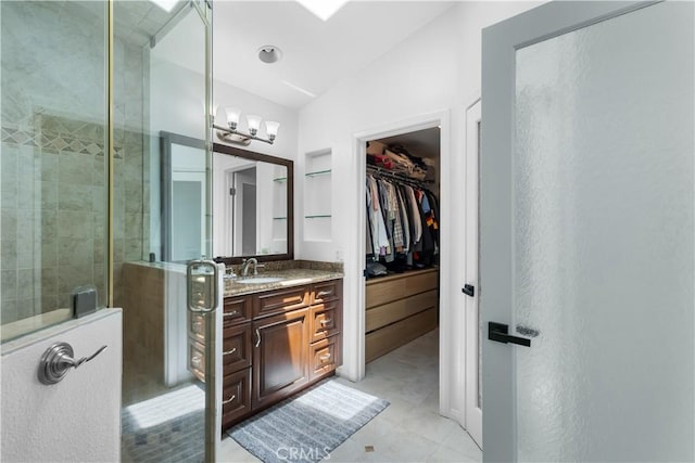 2517 Renata Ct, Thousand Oaks, CA 91362 - full bath featuring vanity, a walk in closet, tiled shower, a chandelier, and tile patterned floors
