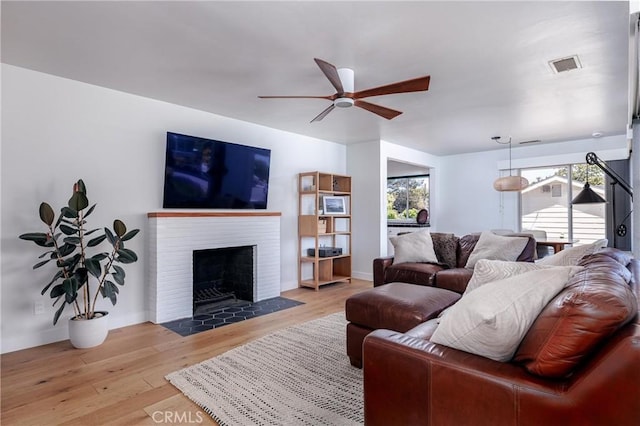 53 Rafael Way, San Luis Obispo, CA 93405 - living room featuring ceiling fan, light wood-style floors, and a fireplace