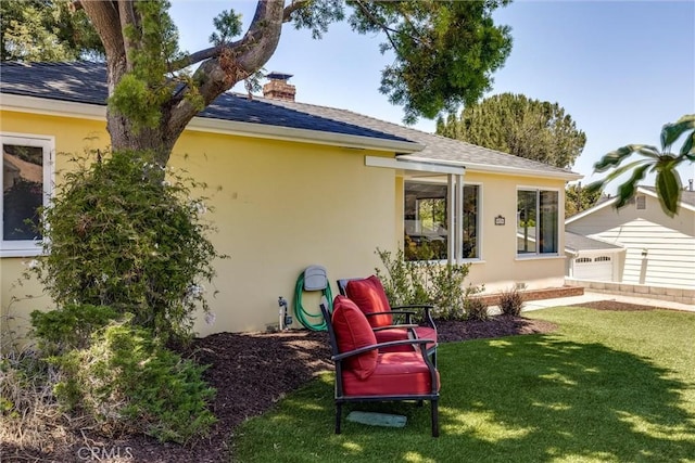 53 Rafael Way, San Luis Obispo, CA 93405 - back of house with stucco siding, a yard, a chimney, and a shingled roof