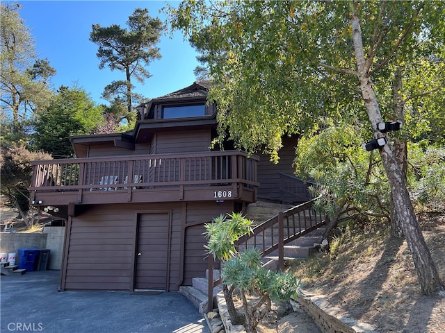 1608 Bradford Rd, Cambria, CA 93428 - rear view of house with stairway and a deck
