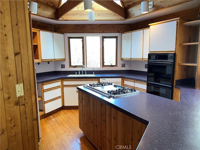1608 Bradford Rd, Cambria, CA 93428 - kitchen featuring open shelves, gas cooktop, white cabinets, and beam ceiling