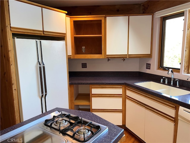 1608 Bradford Rd, Cambria, CA 93428 - kitchen featuring open shelves, white appliances, dark countertops, and white cabinetry