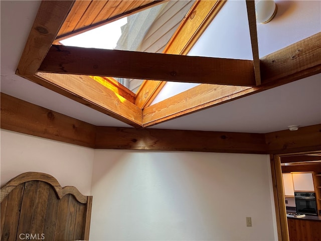 1608 Bradford Rd, Cambria, CA 93428 - detailed view of black oven, a skylight, and beamed ceiling