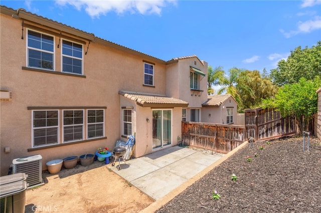 3381 Evening Mist Ln, Perris, CA 92571 - back of property featuring stucco siding, a tiled roof, and a patio area