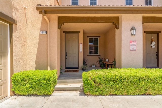 3381 Evening Mist Ln, Perris, CA 92571 - doorway to property featuring stucco siding
