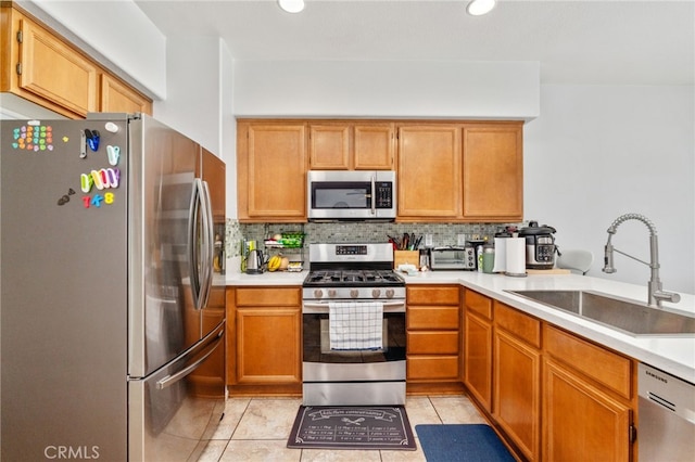 3381 Evening Mist Ln, Perris, CA 92571 - kitchen featuring stainless steel appliances, tasteful backsplash, light countertops, light tile patterned flooring, and recessed lighting
