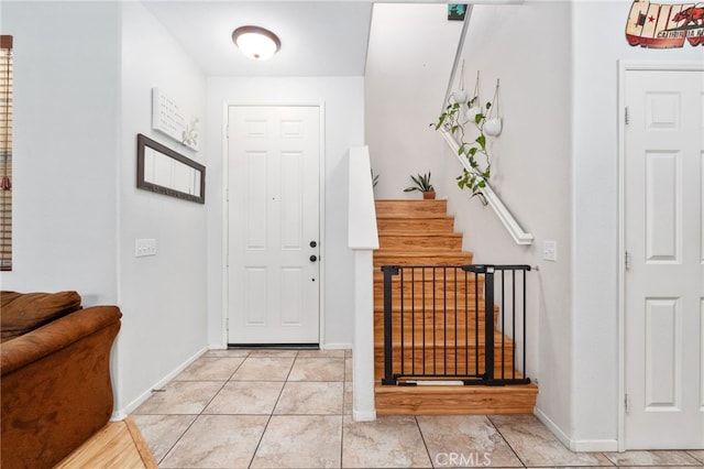 3381 Evening Mist Ln, Perris, CA 92571 - foyer featuring light tile patterned floors and stairway
