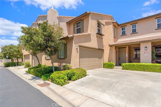 3381 Evening Mist Ln, Perris, CA 92571 - view of front facade featuring a tile roof, driveway, a garage, and stucco siding