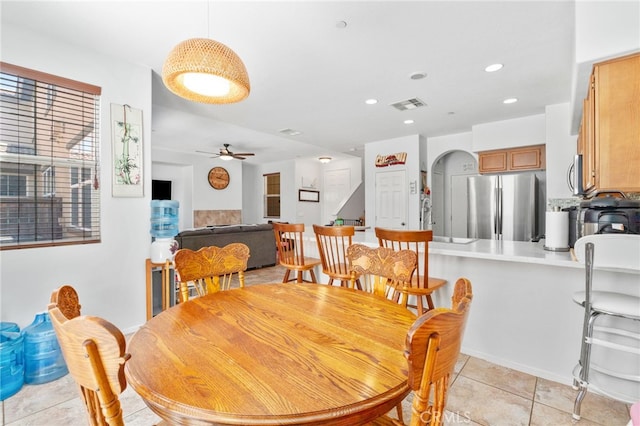 3381 Evening Mist Ln, Perris, CA 92571 - dining room with a ceiling fan, light tile patterned floors, arched walkways, and recessed lighting