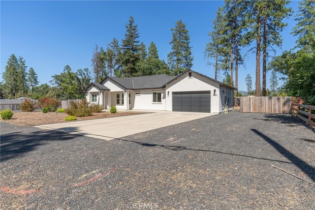 5790 Fickett Ln, Paradise, CA 95969 - view of front of property featuring a garage, concrete driveway, and stucco siding