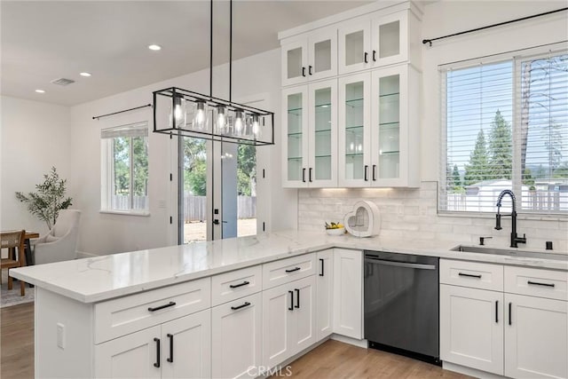 5790 Fickett Ln, Paradise, CA 95969 - kitchen with dishwashing machine, a peninsula, white cabinetry, decorative backsplash, and recessed lighting