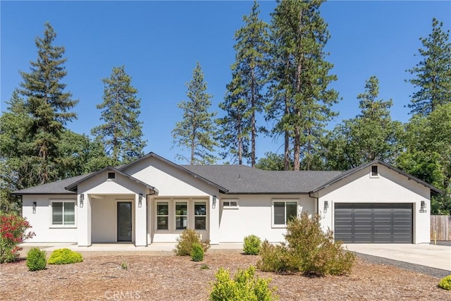 5790 Fickett Ln, Paradise, CA 95969 - ranch-style home featuring stucco siding, a garage, and driveway