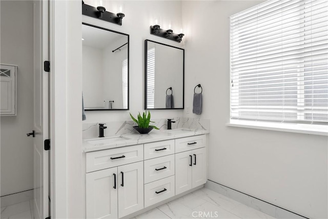 5790 Fickett Ln, Paradise, CA 95969 - bathroom with marble look tile flooring and double vanity
