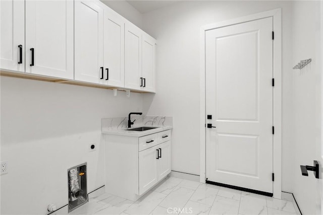 5790 Fickett Ln, Paradise, CA 95969 - laundry area with light marble finish floors, cabinet space, and hookup for an electric dryer