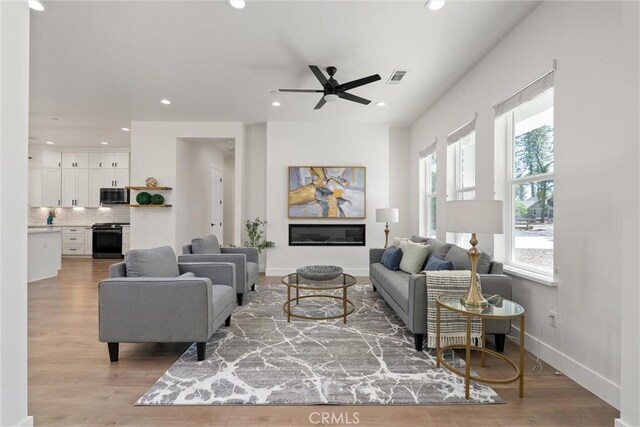 5790 Fickett Ln, Paradise, CA 95969 - living room featuring a ceiling fan, recessed lighting, and light wood finished floors