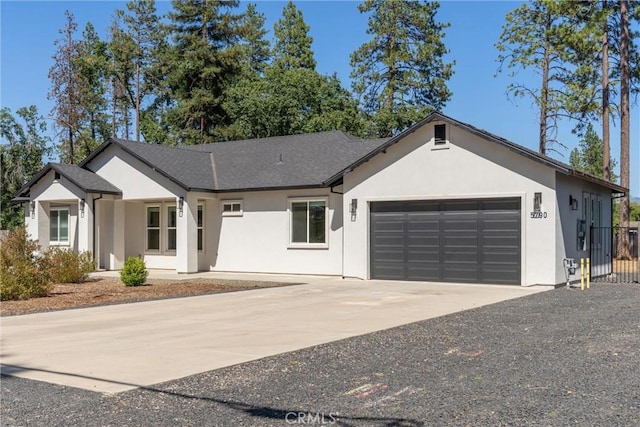 5790 Fickett Ln, Paradise, CA 95969 - ranch-style house with a garage, stucco siding, and driveway