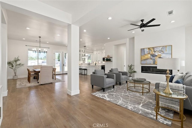 5790 Fickett Ln, Paradise, CA 95969 - living room featuring a ceiling fan, recessed lighting, wood finished floors, and a chandelier