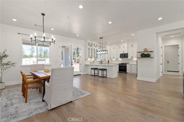 5790 Fickett Ln, Paradise, CA 95969 - dining room with a chandelier, recessed lighting, and light wood finished floors