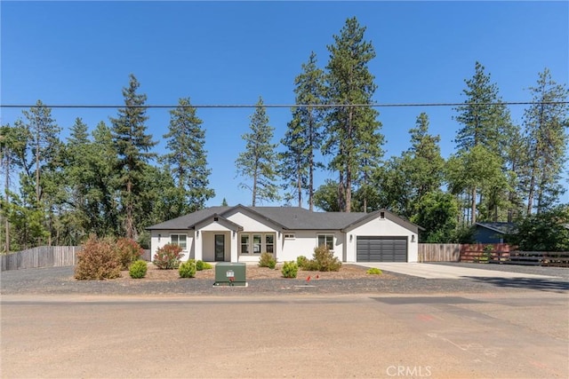 5790 Fickett Ln, Paradise, CA 95969 - view of front facade with an attached garage, driveway, and stucco siding