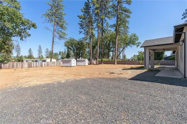 5790 Fickett Ln, Paradise, CA 95969 - fenced backyard featuring a shed and a patio area