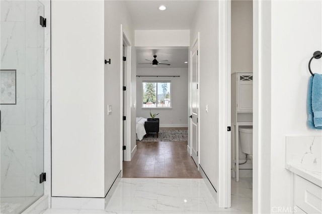 5790 Fickett Ln, Paradise, CA 95969 - hallway featuring light marble finish floors and baseboards