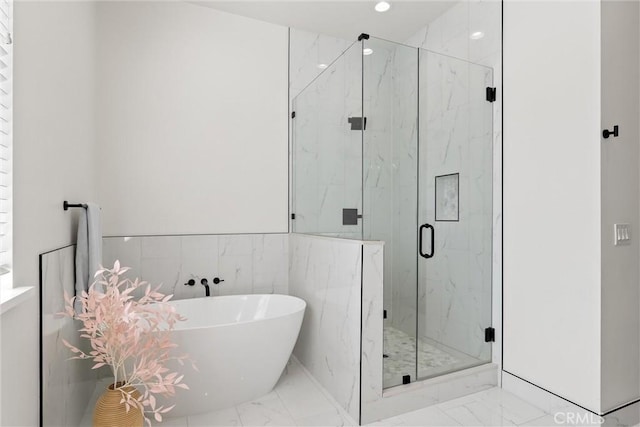 5790 Fickett Ln, Paradise, CA 95969 - bathroom featuring marble look tiles, a soaking tub, a marble finish shower, and recessed lighting