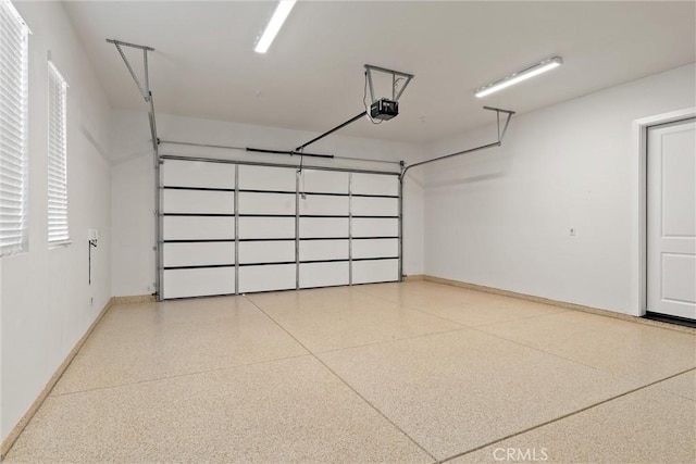 5790 Fickett Ln, Paradise, CA 95969 - garage with baseboards and a garage door opener