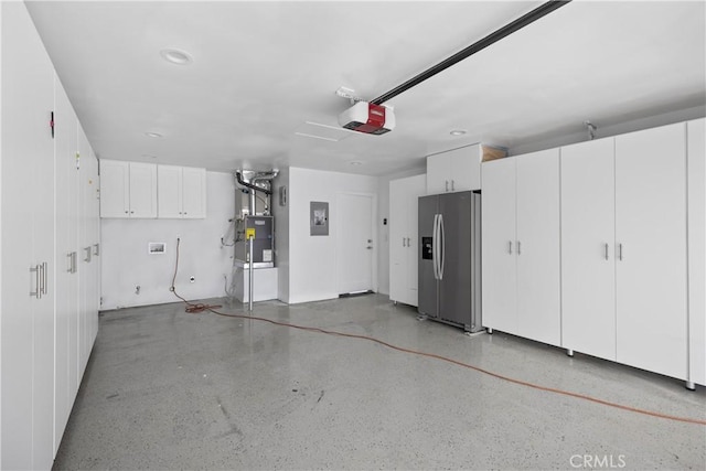 496 E 16th, Costa Mesa, CA 92627 - garage featuring stainless steel refrigerator with ice dispenser, a garage door opener, and electric panel