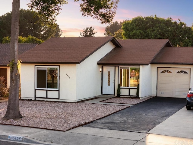 1405 Highridge Dr, Oceanside, CA 92056 - view of front of property with driveway, an attached garage, stucco siding, and roof with shingles
