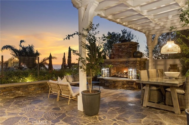 33 Renata, Newport Coast, CA 92657 - view of patio / terrace with an outdoor stone fireplace and a pergola