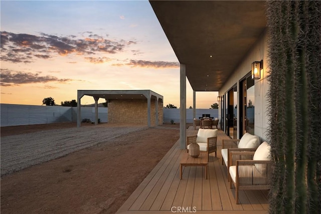 60632 Granville Rd, Joshua Tree, CA 92252 - deck at dusk with an outdoor living space