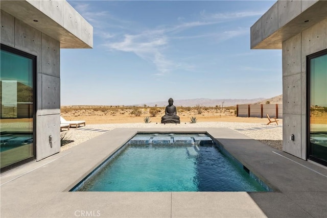 60632 Granville Rd, Joshua Tree, CA 92252 - view of swimming pool featuring a mountain view, a pool with connected hot tub, and a patio area