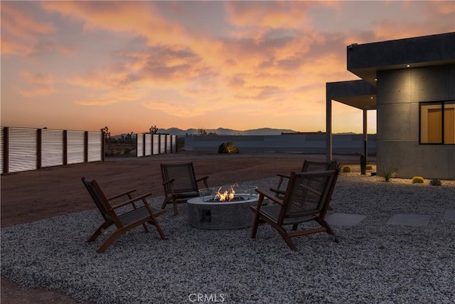 60632 Granville Rd, Joshua Tree, CA 92252 - patio terrace at dusk featuring a fire pit