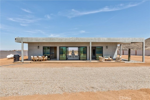 60632 Granville Rd, Joshua Tree, CA 92252 - rear view of house featuring a patio area and an outdoor living space