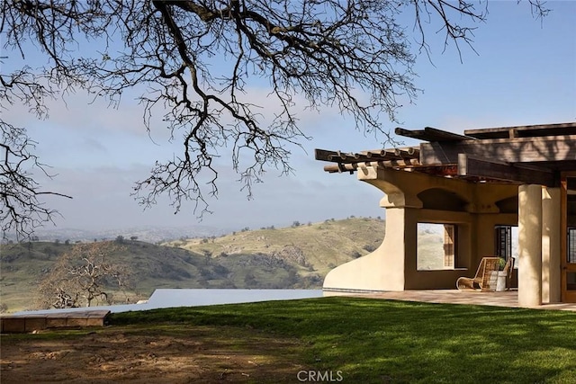 19623 Rd 211, Friant, CA 93626 - view of green lawn featuring a mountain view and a patio area