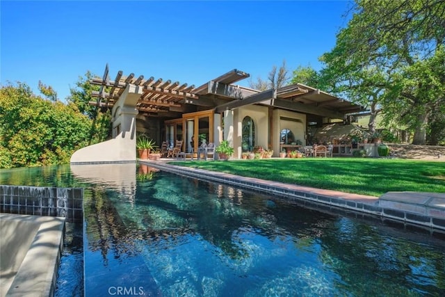 19623 Rd 211, Friant, CA 93626 - back of house featuring a yard, stucco siding, a patio area, an outdoor pool, and a pergola