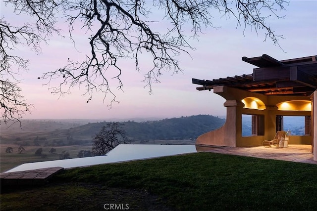 19623 Rd 211, Friant, CA 93626 - yard at dusk with a lawn and a patio area