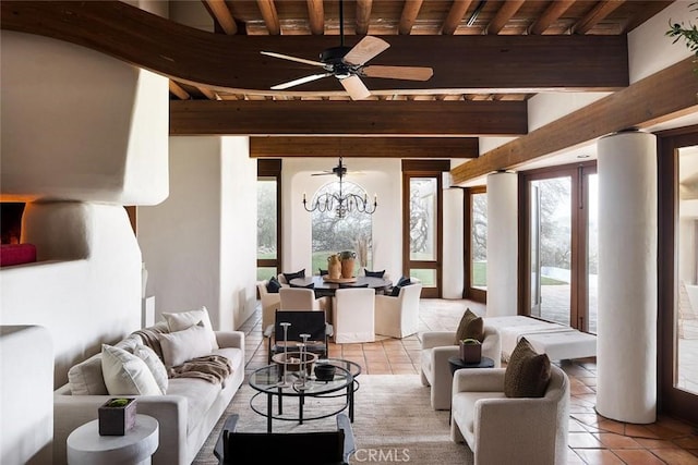 19623 Rd 211, Friant, CA 93626 - living room with light tile patterned floors, a ceiling fan, a wood ceiling with exposed beams, and a chandelier