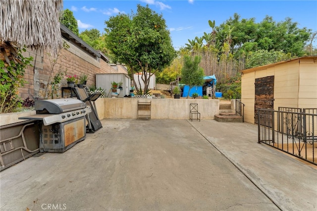 1153 Isabel St, Los Angeles, CA 90065 - view of patio / terrace featuring grilling area and a storage shed