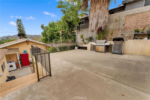 1153 Isabel St, Los Angeles, CA 90065 - view of patio / terrace featuring grilling area, a gate, and washer / clothes dryer