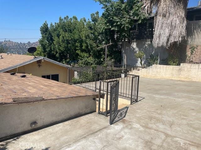1153 Isabel St, Los Angeles, CA 90065 - view of patio with concrete driveway and a gate