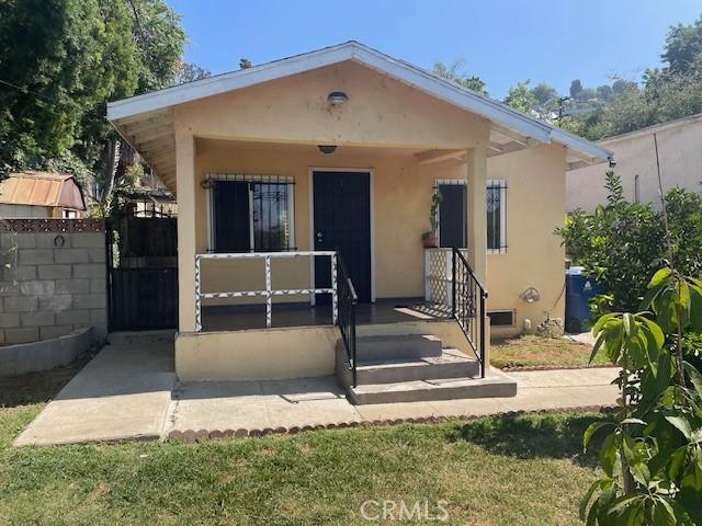 1153 Isabel St, Los Angeles, CA 90065 - bungalow with stucco siding and covered porch