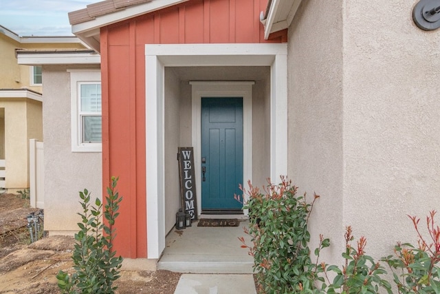 36961 Buccella Ln, Beaumont, CA 92223 - doorway to property with board and batten siding and stucco siding