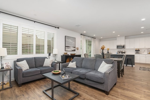 36961 Buccella Ln, Beaumont, CA 92223 - living room featuring light wood finished floors, healthy amount of natural light, and recessed lighting