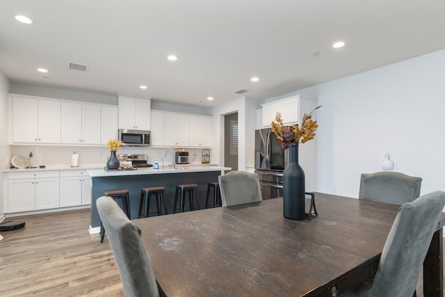 36961 Buccella Ln, Beaumont, CA 92223 - dining area featuring light wood-style floors and recessed lighting