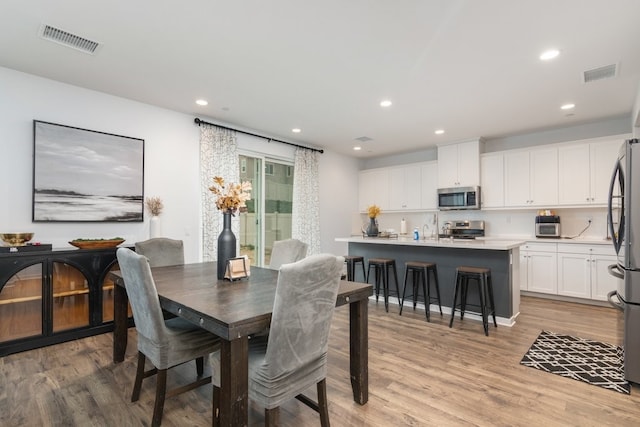 36961 Buccella Ln, Beaumont, CA 92223 - dining room with light wood-style flooring and recessed lighting